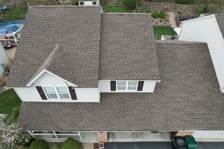 Stylish home with GAF Timberline HDZ Weathered Wood Architectural Shingles for enhanced curb appeal and protection"